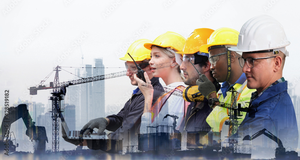 Group of architects and engineers at a building site , Team of expert architects on construciton site in helmets checking workflow