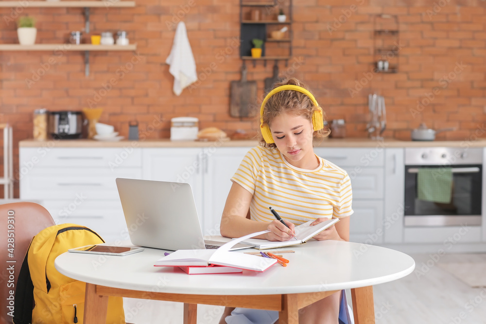 Female student studying online at home
