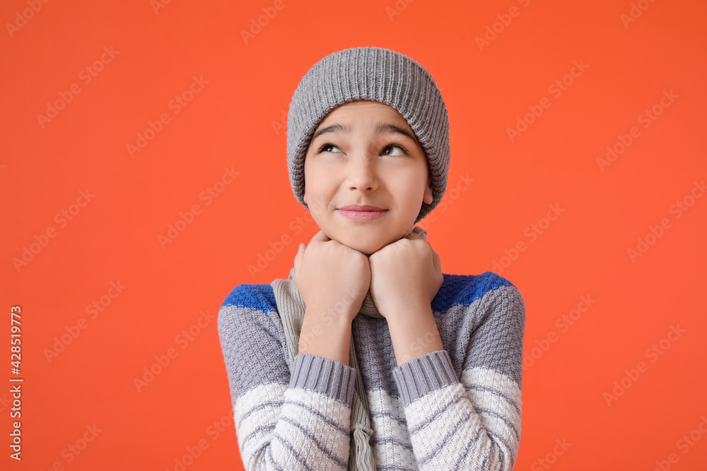 Stylish little boy in warm clothes on color background Stylish little boy in warm clothes on color background
