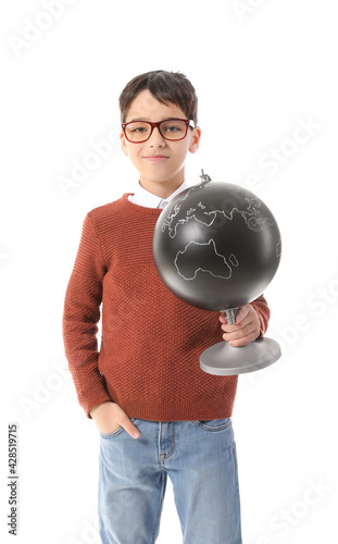 Young boy in glasses holdin...