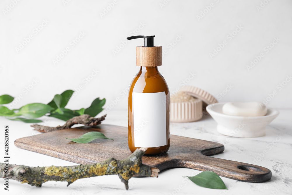 Bottle with natural shampoo on light background - obrazy, fototapety, plakaty 