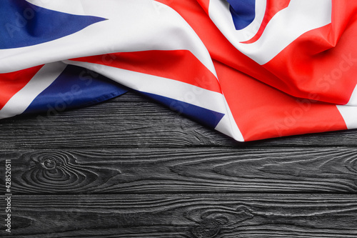 National flag of the United Kingdom on wooden background photo