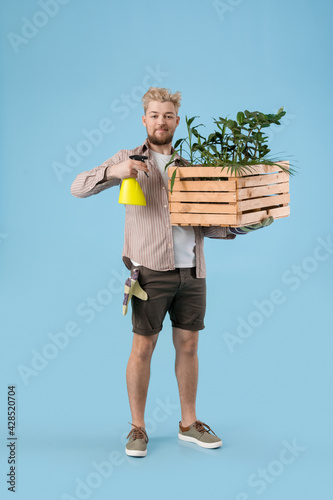 Young male gardener on colo...