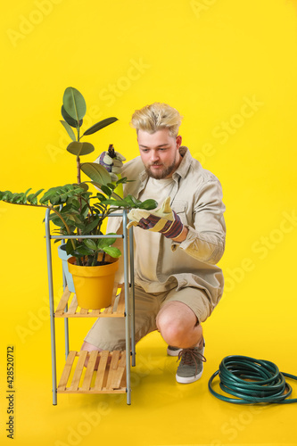 Young male gardener on colo...