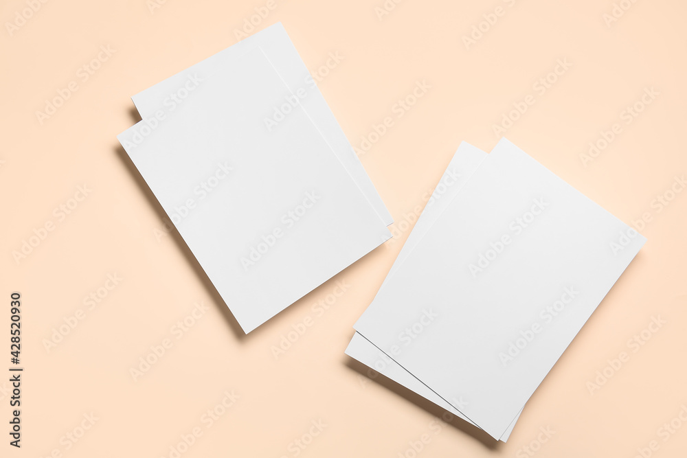 Blank sheets of paper on color background Blank sheets of paper on color background