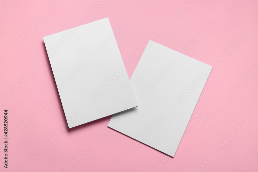 Blank sheets of paper on color background Blank sheets of paper on color background