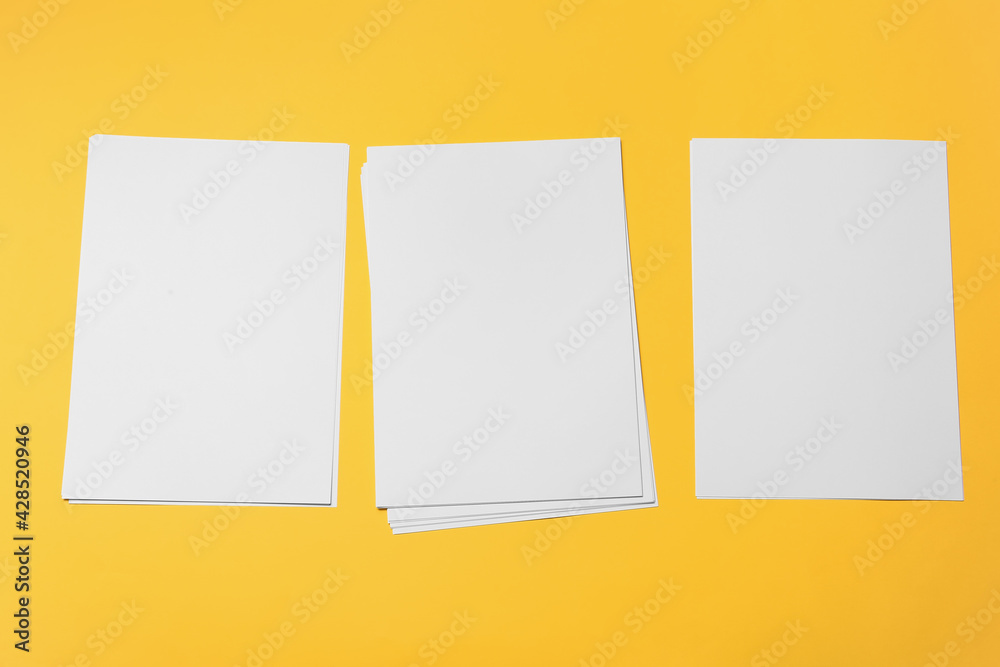 Blank sheets of paper on color background Blank sheets of paper on color background