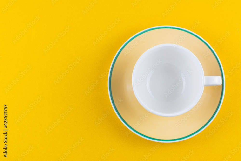 Empty white coffee cup on yellow background. Empty white coffee cup on yellow background.