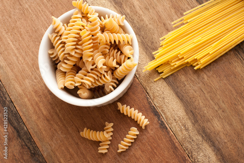 Dried Italian spiral fusilli and spaghetti pasta © Stephen Gibson