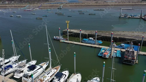 Aerial view of yachts and sailboats moored at marina photo