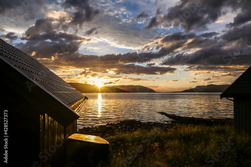 dramatic sky of midnight sun Vikebukt, Norway