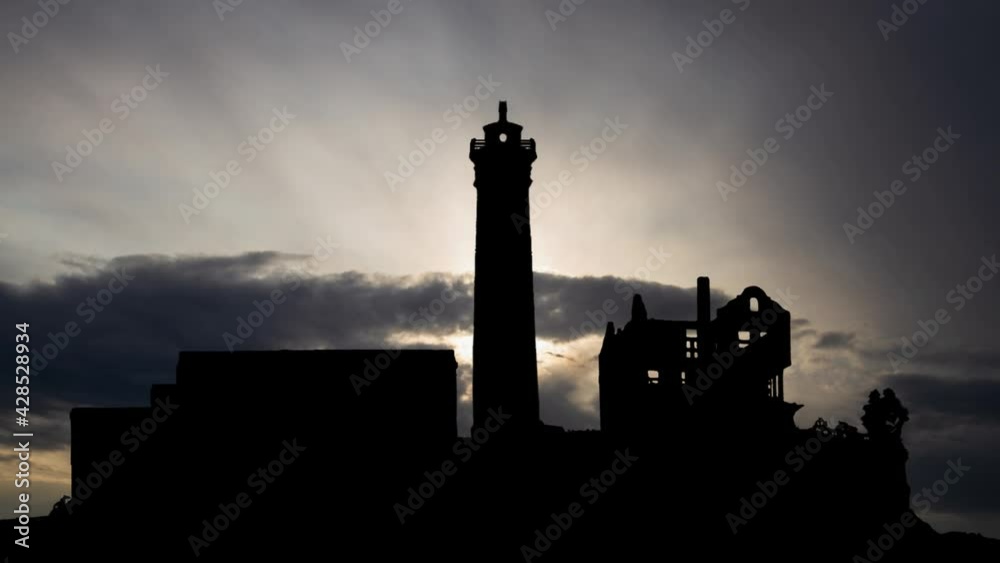 Alcatraz Island a Sunrise:  Time Lapse with Fast Clouds and Dark Silhouette of Prison, San Fransico