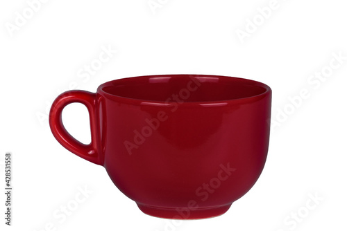Red mug for tea with a handle on a white background.