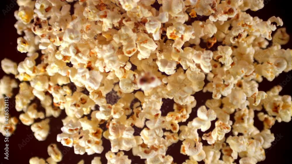 Super slow motion popcorn rises up. On a black background.Filmed on a high-speed camera at 1000 fps. High quality FullHD footage