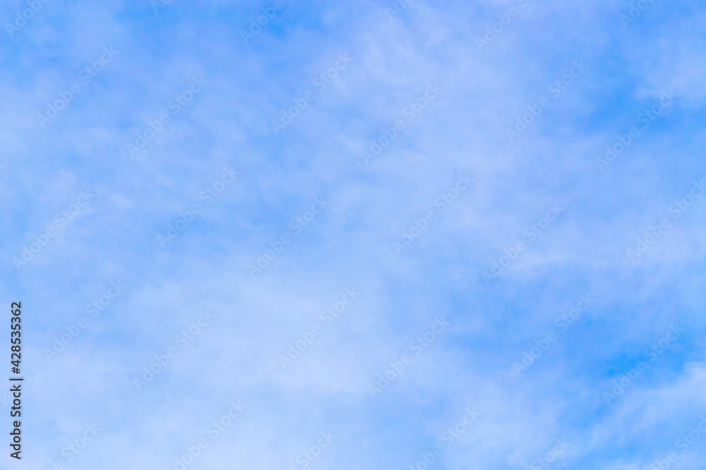 Cloudy blue sky background on sunny day