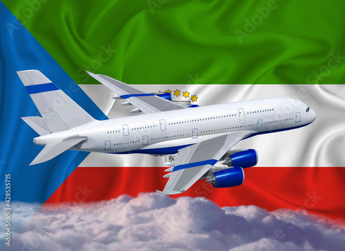 Equatorial Guinea flag with white airplane and clouds. The concept of tourist international passenger transportation. photo