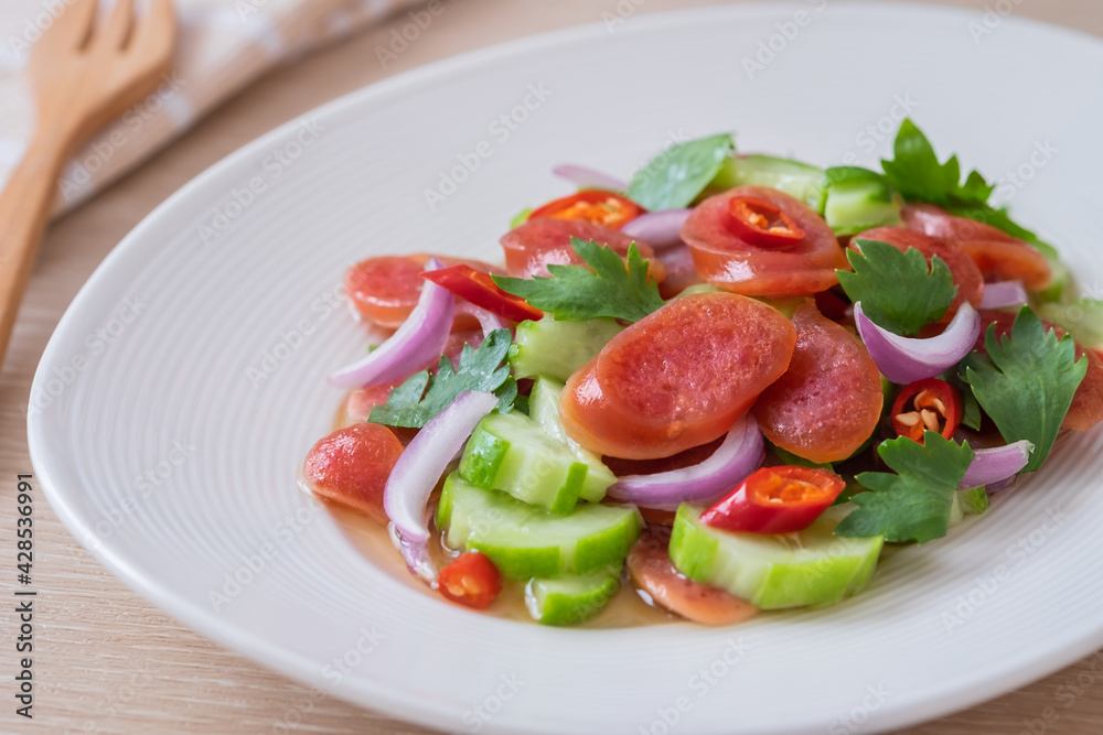 Spicy chinese pork sausage salad on plate, Thai food Spicy chinese pork sausage salad on plate, Thai food