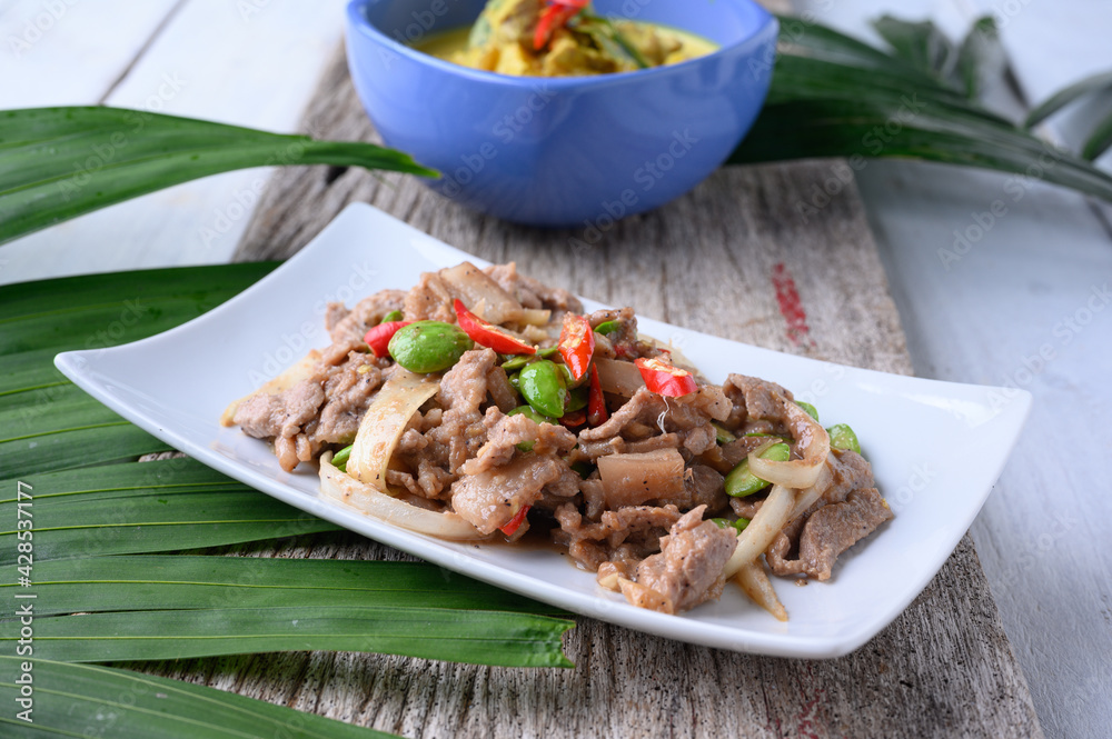 Stir Fried Pork with Shrimp Paste and bitter beans. Stir Fried Pork with Shrimp Paste and bitter beans.