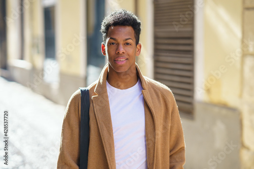 Obraz na płótnie Young Cuban man standing in the street.