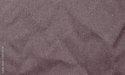 Light maroon wrinkled fabric texture for background