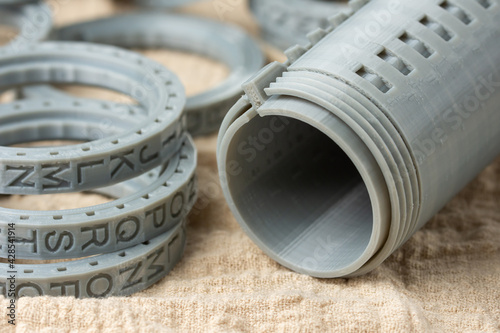 Close-up of plastic cryptex printed on a 3D printer. Printed by FDM technology with gray filament.