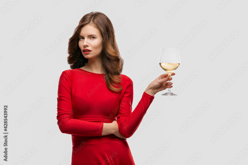 Beautiful woman holding glass of wine onwhite background Beautiful woman holding glass of wine onwhite background