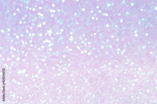 Shiny blurred purple background with bokeh for a festive mood. Greeting card template for fun.
