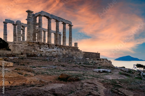 Sounion, Attica - Greece: Colorful sunset at Cape Sounion with the Temple of Poseidon. One of the Twelve Olympian Gods in ancient Greek religion and myth. God of the sea, earthquakes. Nobody