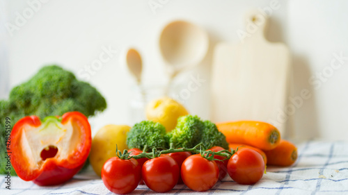 Fresh vegetables on the table. Tomatoes, broccoli, carrots, peppers