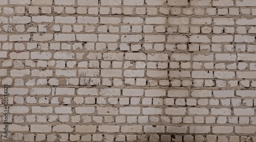 Horizontal white brick wall. The back wall of the garage.