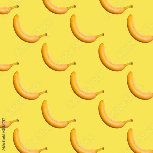 Banana seamless pattern on yellow background. Trendy colors Summer tropical exotic fruit pattern, concept. Nature background., gift wrapping paper, textile print design.