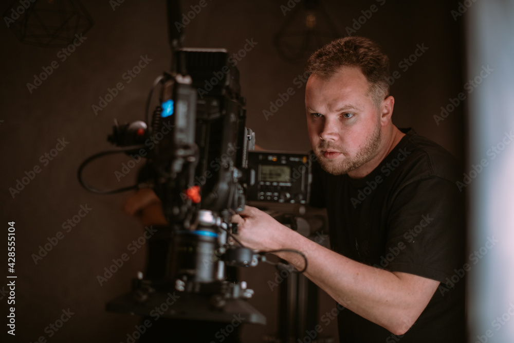 Director of photography with a camera in his hands on the set. Director of photography with a camera in his hands on the set.