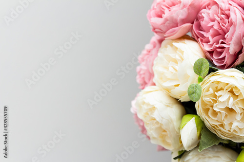 Fototapeta Naklejka Na Ścianę i Meble -  bouquet of artifical roses close up