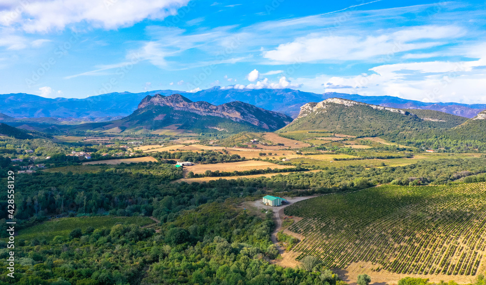Beautiful scenery of the mountains in the Desert des Agriates with blue sky. Landscape near Saint Florent, Corsica, Deparment Haut-Corse, France.  Aerial view. 