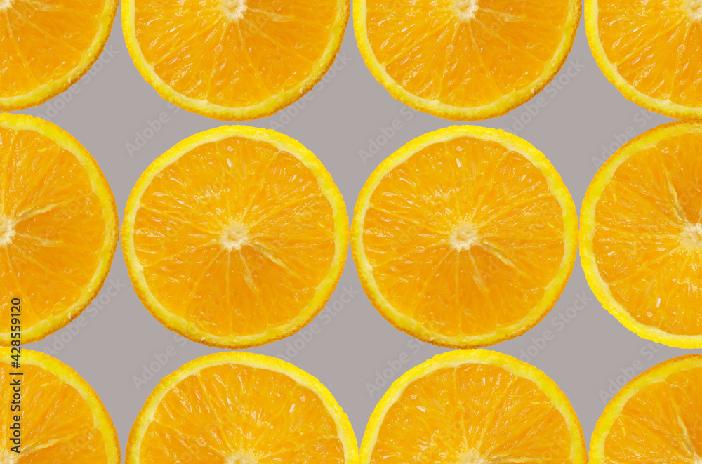 Orange Fruit slice Background. Healthy food lifestile. Food trendy yellow gray background. Applicable for fruit juice advertising. Frame, border. Copy space for text. Summer concept. Orange Fruit slice Background. Healthy food lifestile. Food trendy yellow gray background. Applicable for fruit juice advertising. Frame, border. Copy space for text. Summer concept.