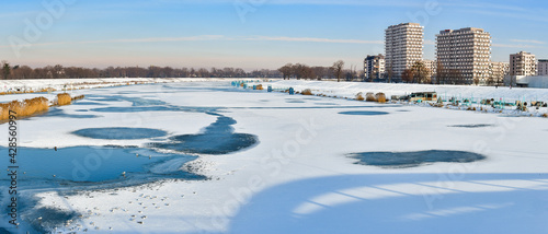 Ice floe in winter across the width of the Odra River in Wroclaw. The ice-bound river makes it impossible to navigate.