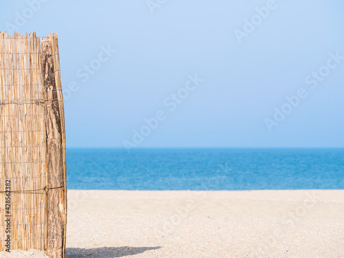 Summer landscape with a straw fence on the Modern beach in Constanta Romania © Cristi