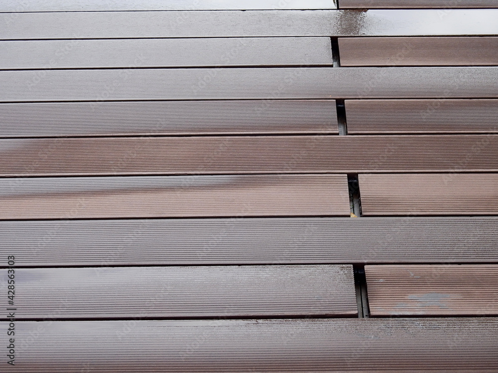 Fototapeta premium wet artificial wood flooring after rain