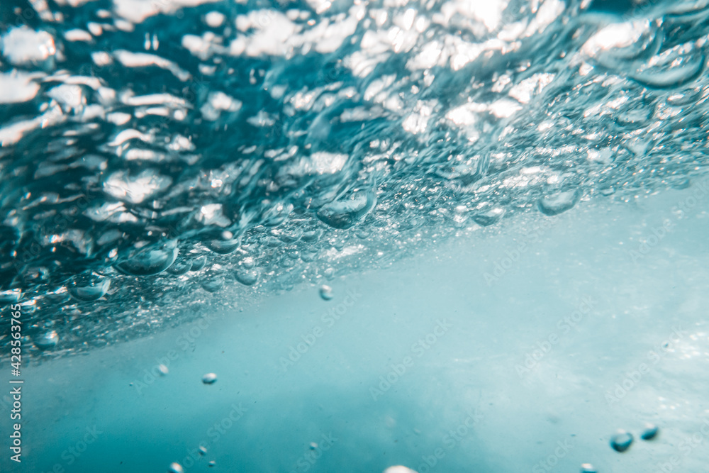 Underwater View of Bubbles In Deep Blue Sea. Close Up Water. Background Underwater View of Bubbles In Deep Blue Sea. Close Up Water. Background