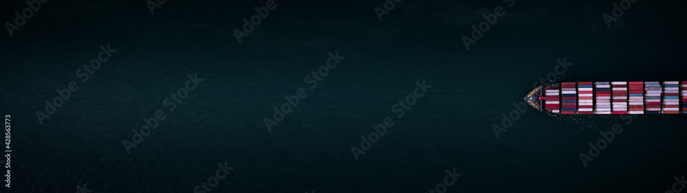 Container ship for import and export, business logistic and transportation by container ship in open sea, Aerial top view container cargo ship with copy space for design banner web background . Container ship for import and export, business logistic and transportation by container ship in open sea, Aerial top view container cargo ship with copy space for design banner web background .