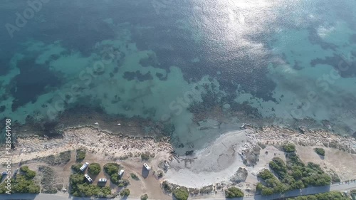 aerial view of sea and wild camping motorhomes  