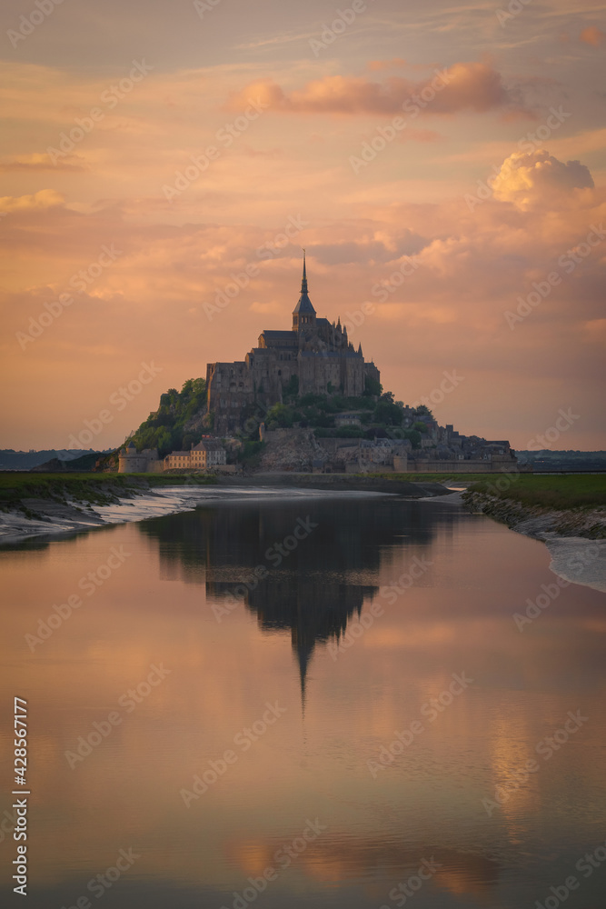 The Mont Saint Michel and its bay at the sunset. Normandy, France