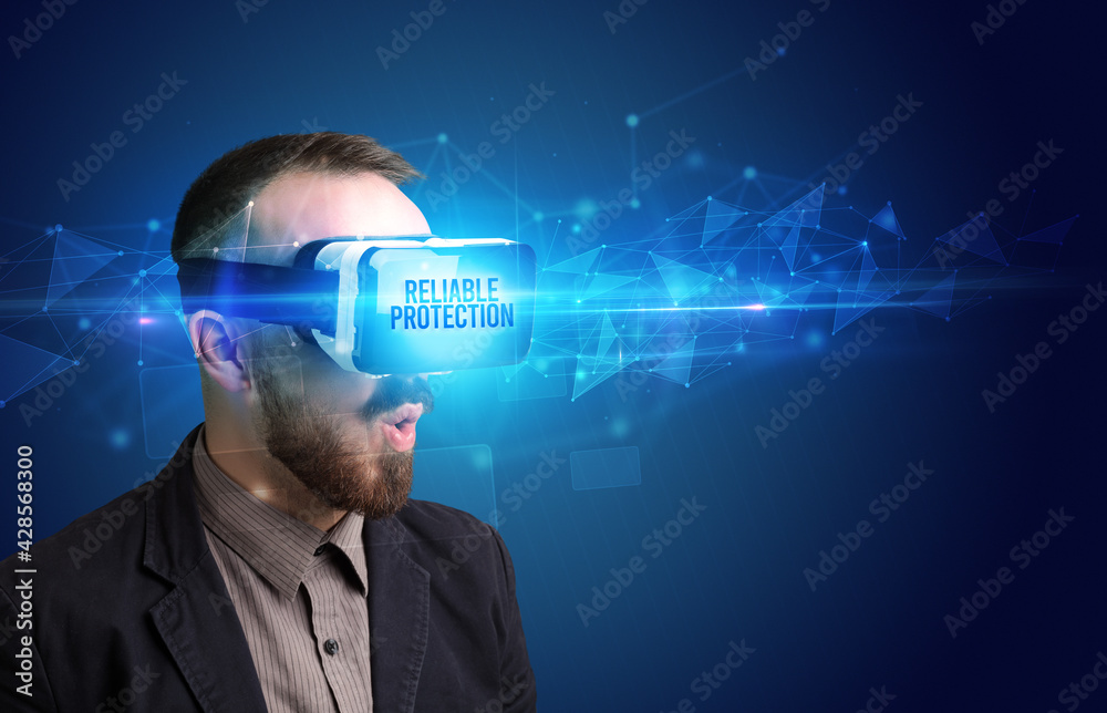 Businessman looking through Virtual Reality glasses, virtual security concept Businessman looking through Virtual Reality glasses, virtual security concept
