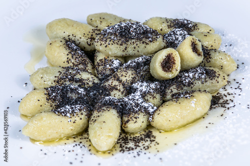 Potato noodles stuffed with poppy seeds. The food in the restaurant. Food styling and restaurant meal serving.