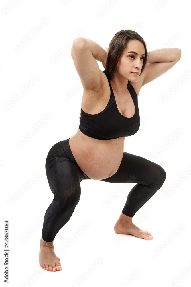 Pregnant woman doing fitness exercises Pregnant woman doing fitness exercises