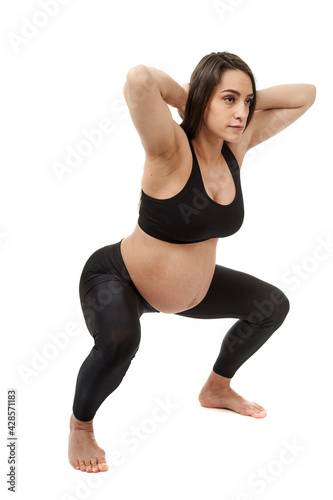 Pregnant woman doing fitness exercises © Xalanx