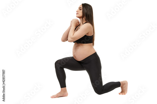 Fotografie Pregnant woman doing fitness exercises