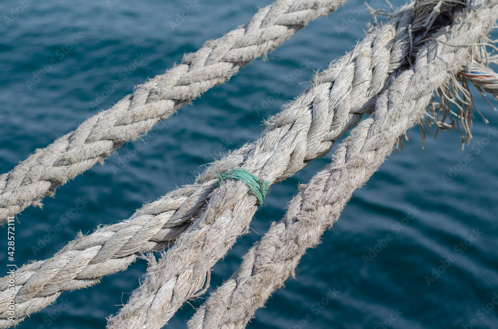 Mooring the ship. Marine rope. Knot. Sisal rope. Marine pier.