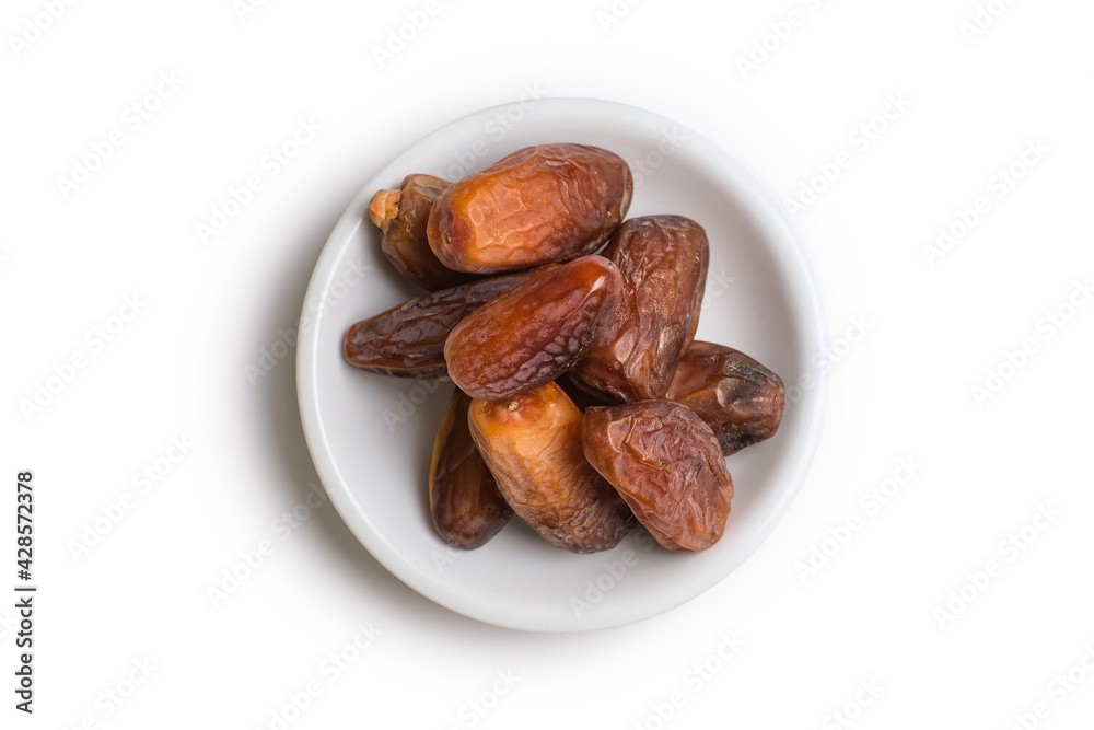 Piles of dates isolated on white Piles of dates isolated on white