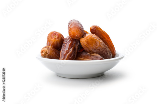 Piles of dates isolated on white
